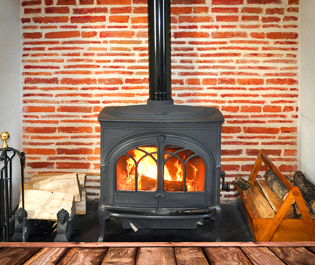 wood fireplace with stacks of wood